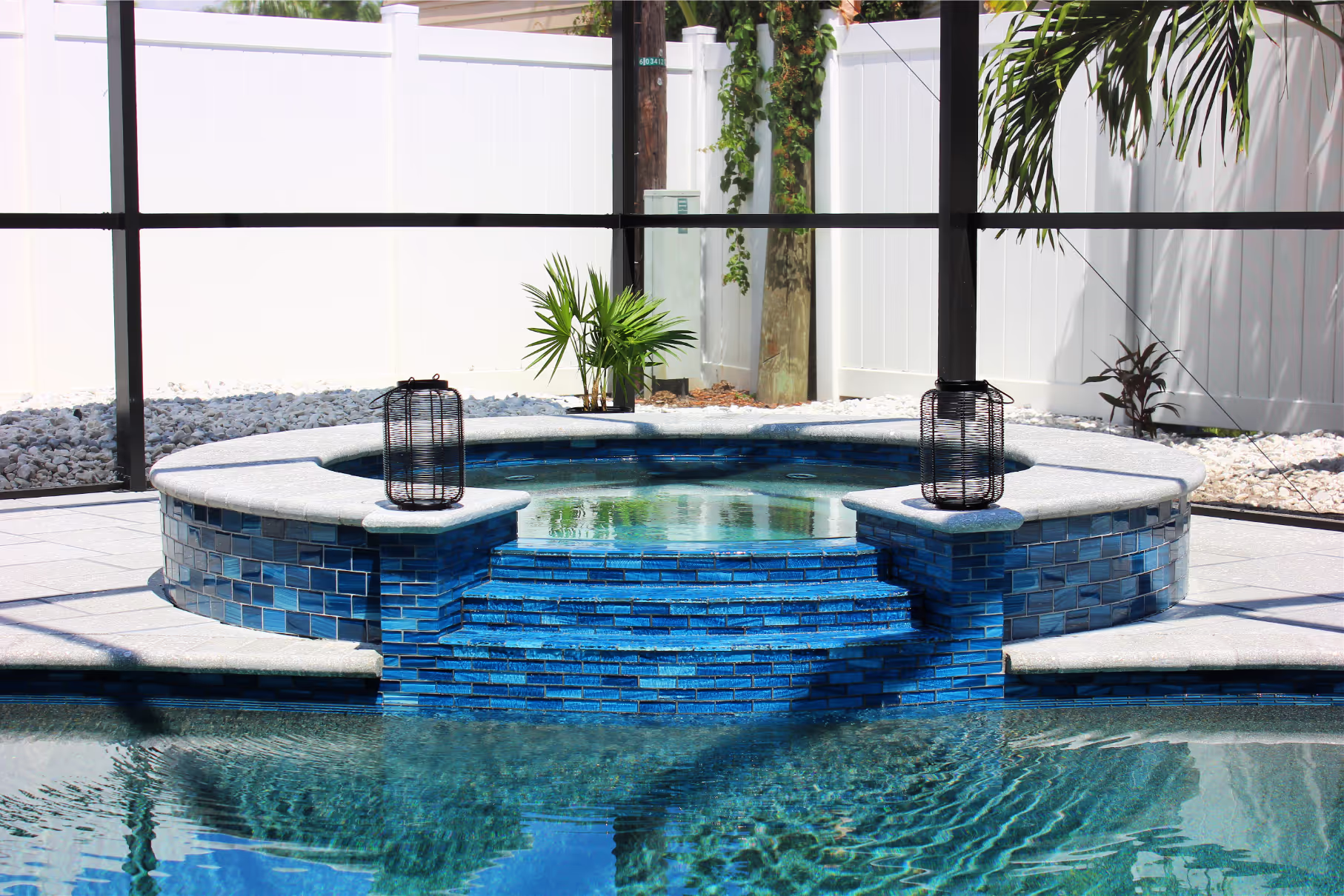 Custom-shaped concrete pool built for a wooded Lake Magdalene lot