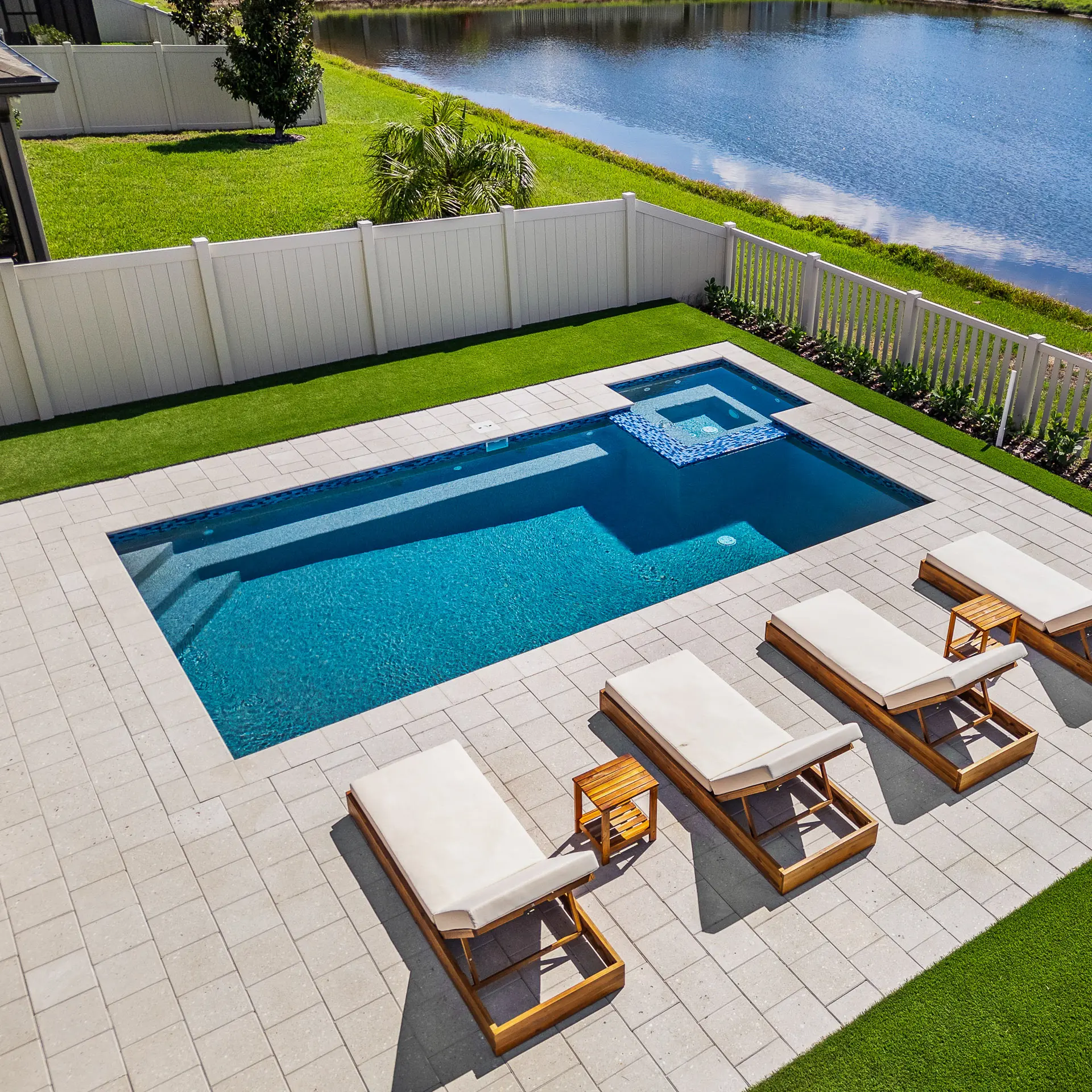 Aerial view of a custom concrete pool in a Tampa Bay backyard