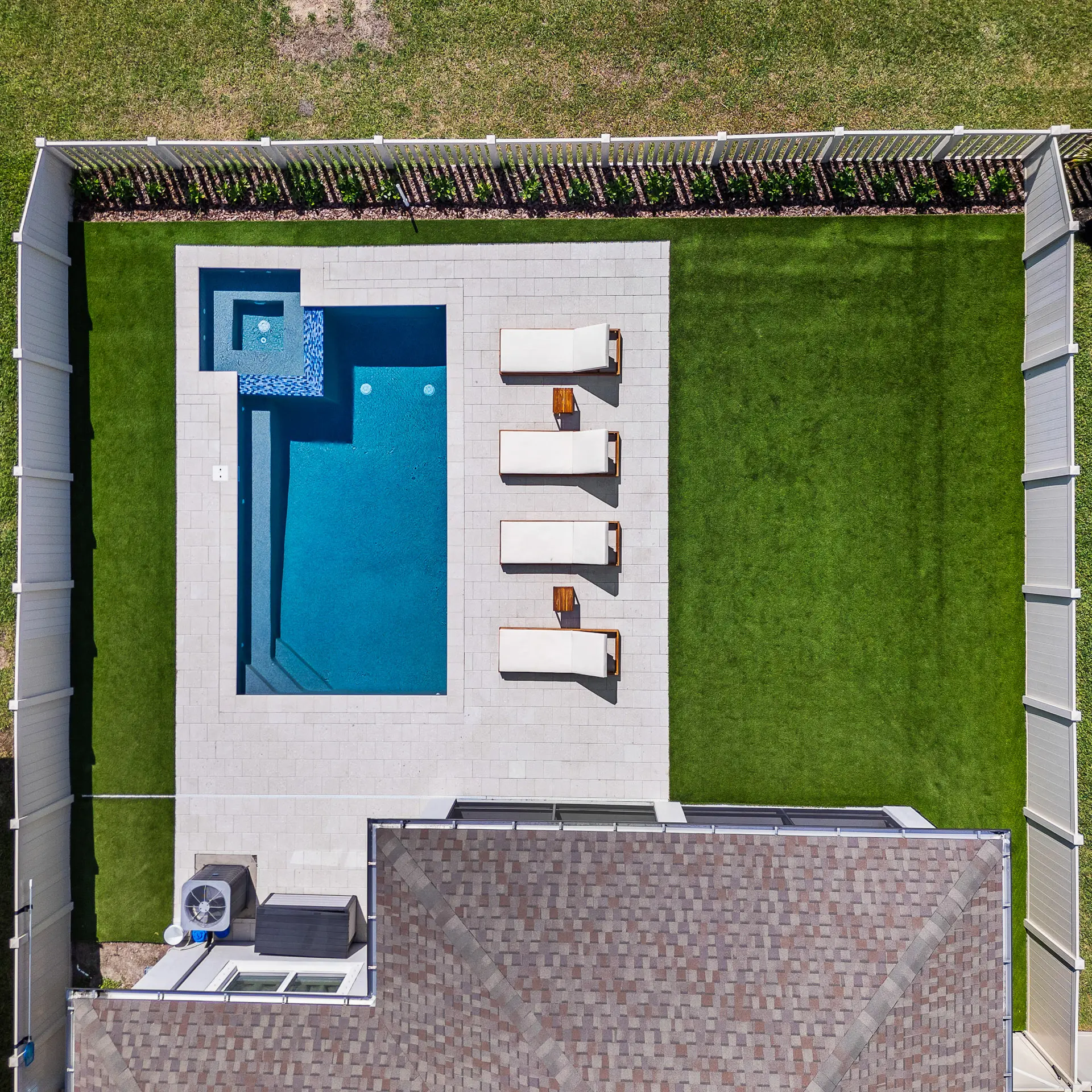 Aerial view of a finished custom pool build in a Tampa backyard