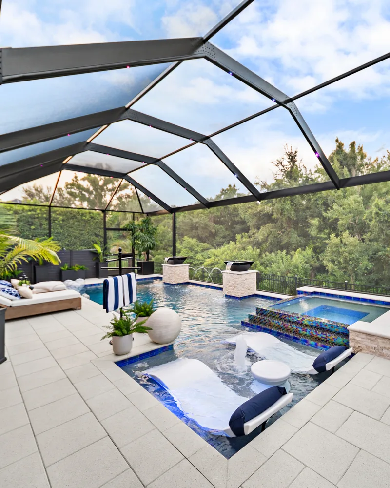 Custom pool with stone pillars, water bowls and deck jets built by Pool Perfection in Tampa