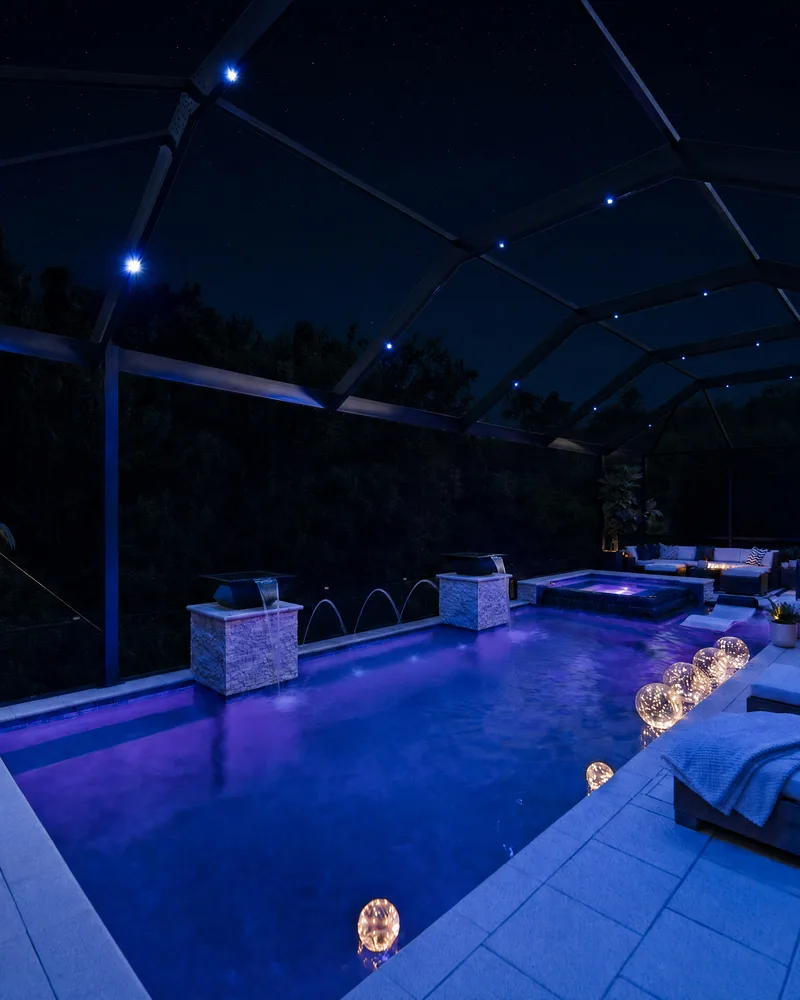 Custom pool with stone pillars, water bowls and deck jets built by Pool Perfection in Tampa