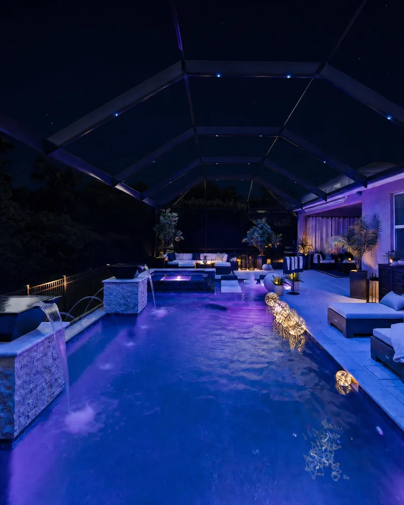Custom pool with stone pillars, water bowls and deck jets built by Pool Perfection in Tampa