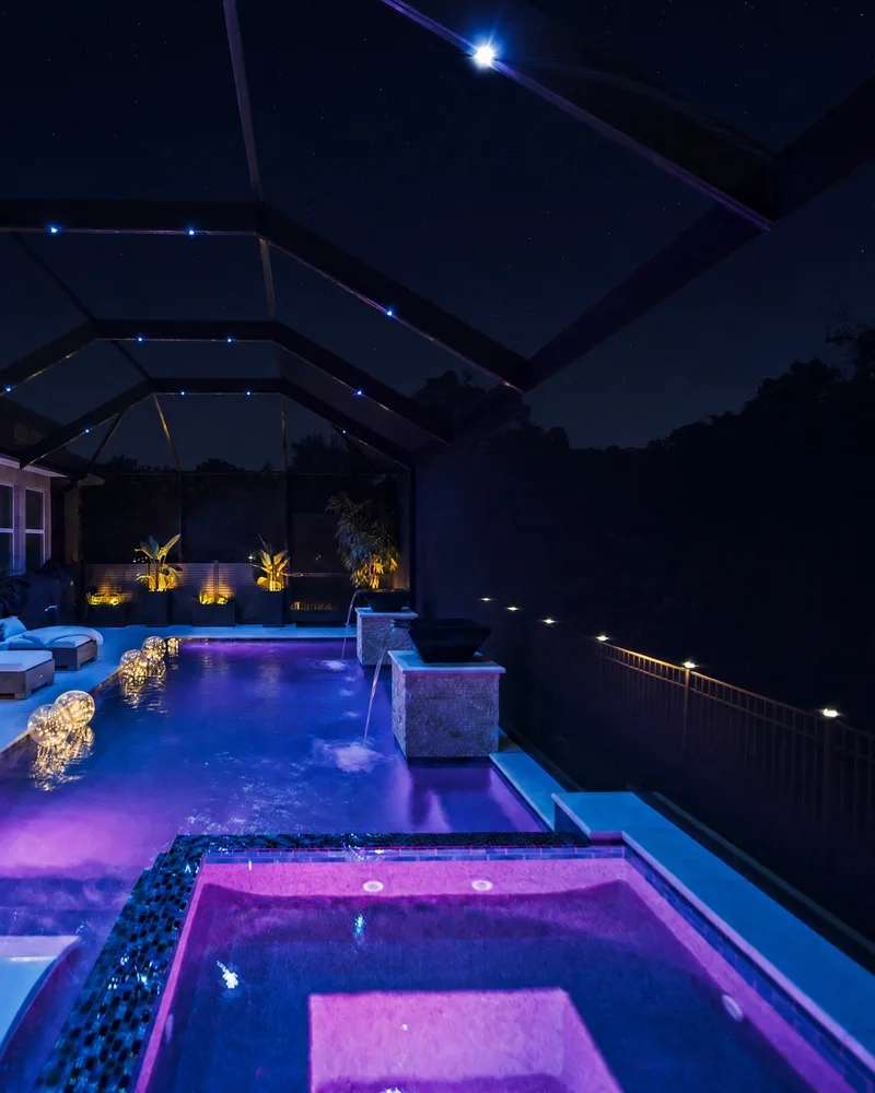 Custom pool with stone pillars, water bowls and deck jets built by Pool Perfection in Tampa