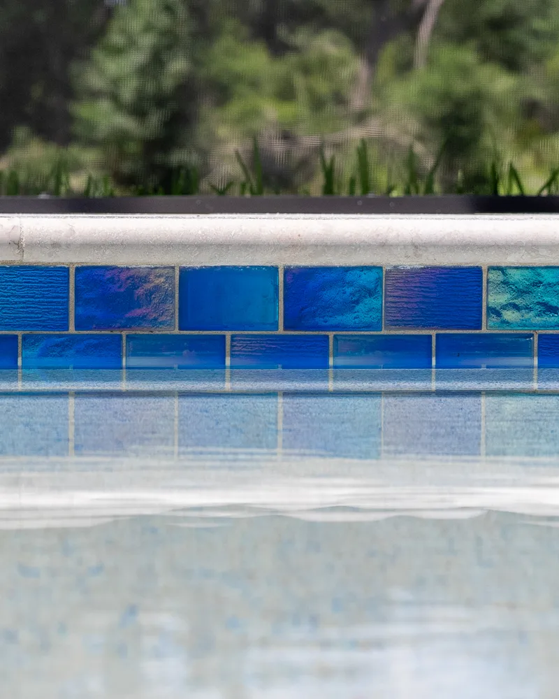 Close view of Maretzi Blue Lagoon glass waterline tile